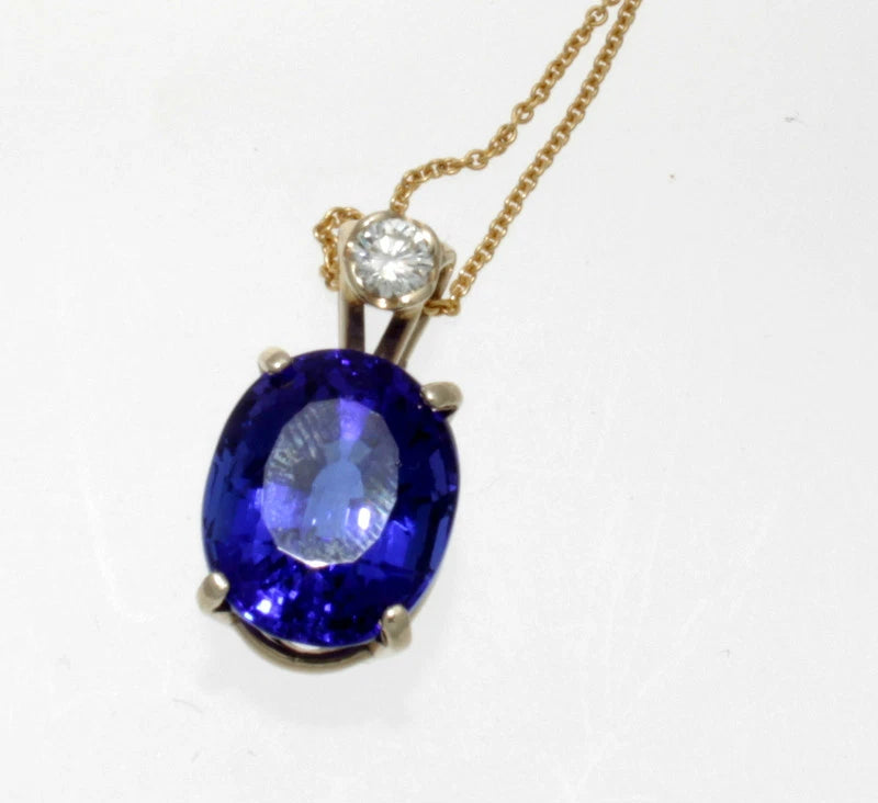 14K YELLOW GOLD, DIAMOND & OVAL TANZANITE PENDANT 15.40 TCW.