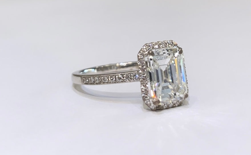 18K WHITE GOLD, EMERALD CUT WITH DIAMOND HALO, ENGAGEMENT RING